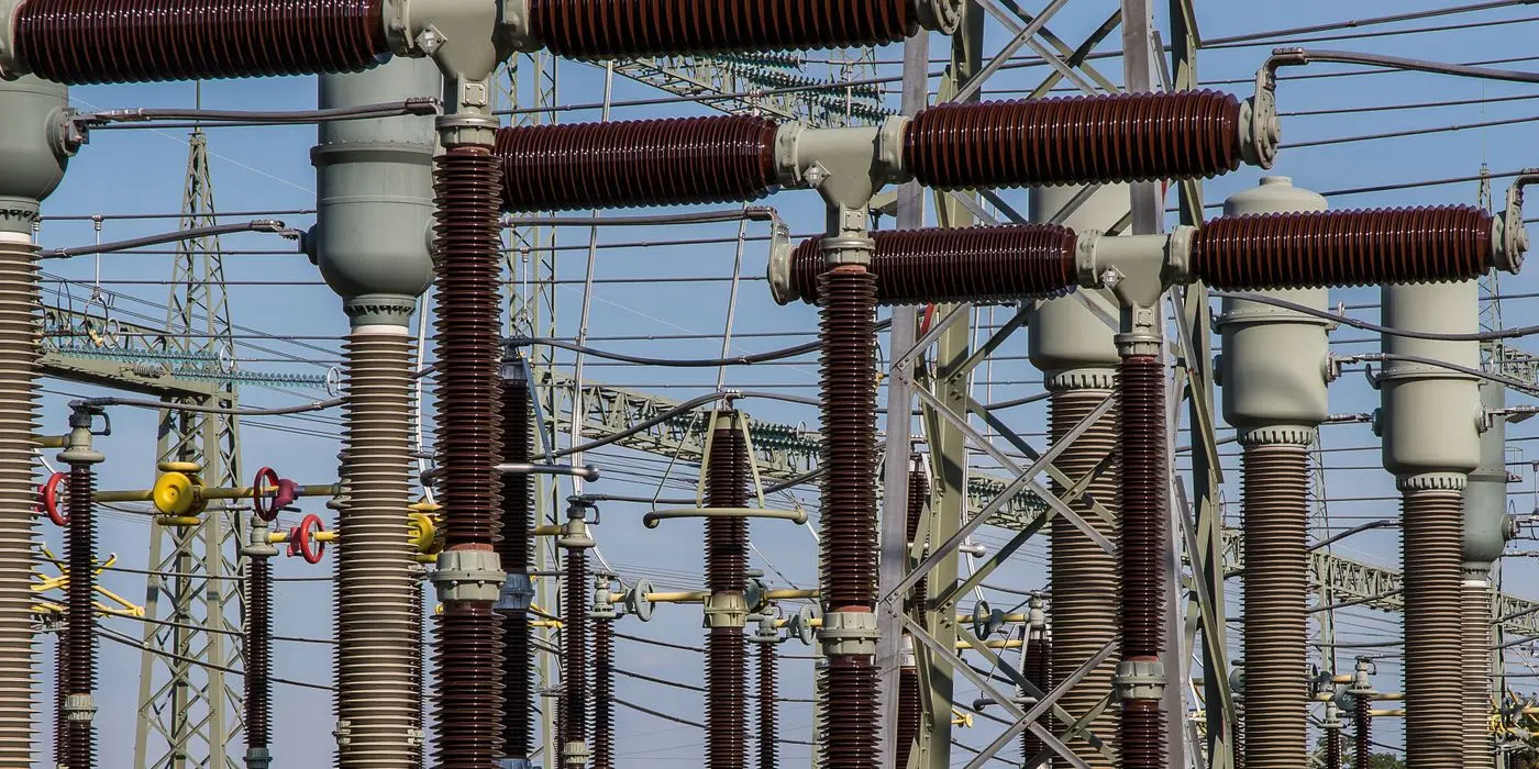 High-voltage switchgear and insulators at an electricity substation